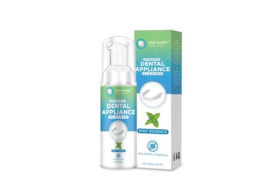 A bottle and box of Clear Comfort night guard cleaning solution with mint essence labeled dental appliance cleaner.