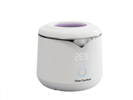 White ultrasonic night guard cleaner with LED display and silver trim, labeled “Clear Comfort.”