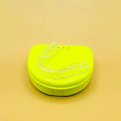 mouthguard sitting on a yellow case
